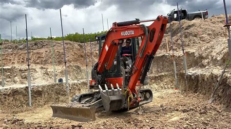 how to put the track back on a mini excavator|mini excavator track release.